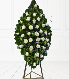 Corona fúnebre en rosas blancas